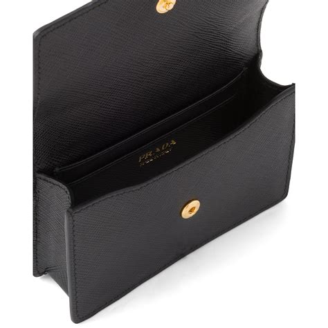 Saffiano leather card holder with shoulder strap .